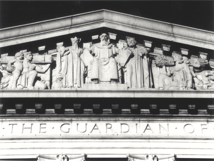 A black and white photo of the front of a building.