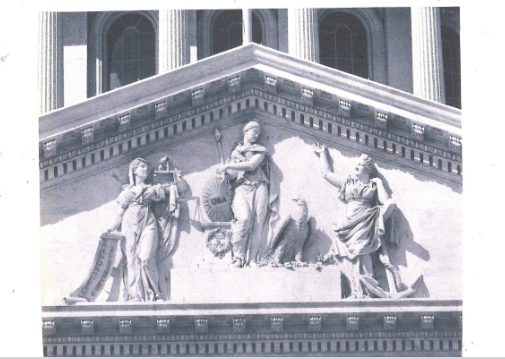 A black and white photo of the front of a building.